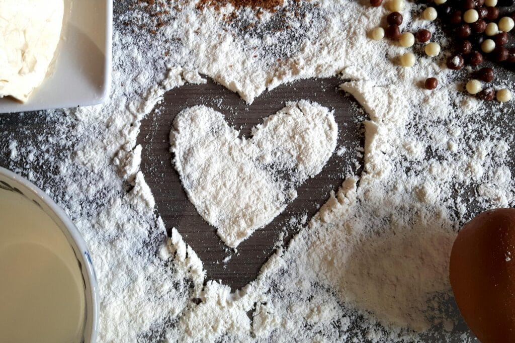 a heart shape drawn on flour